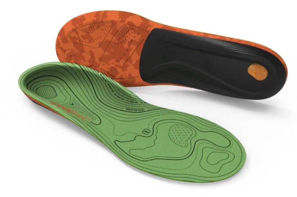 A pair of Superfeet hiking support insoles.
