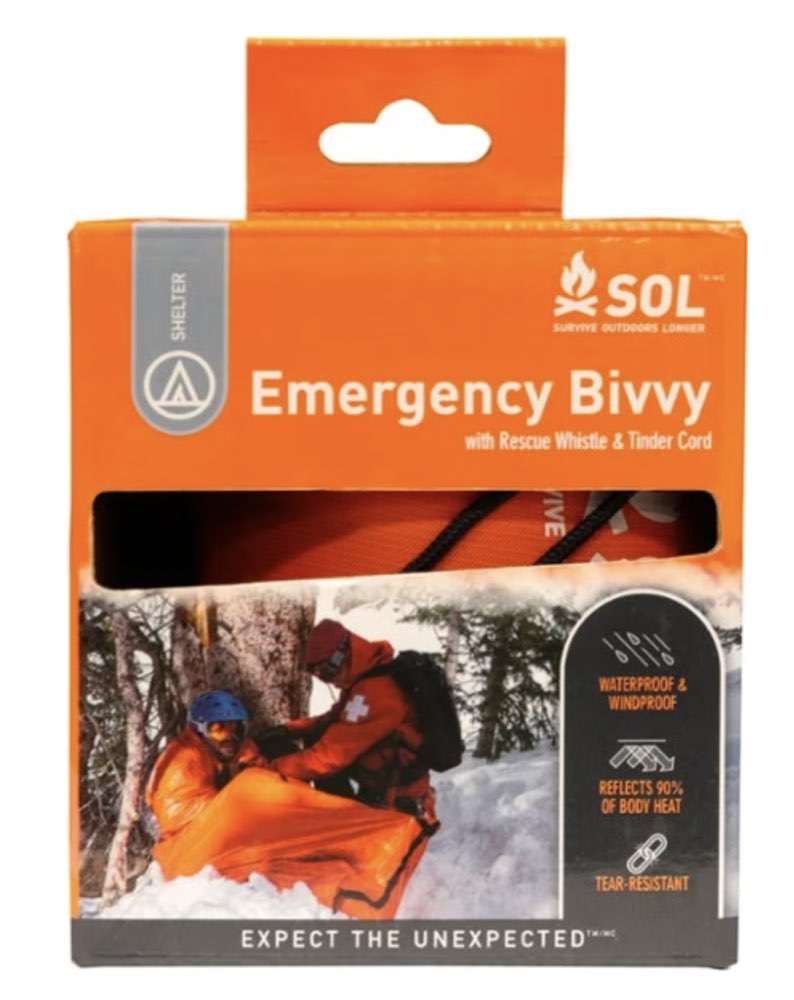 A compact SOL emergency bivvy sack with its stuff sack.