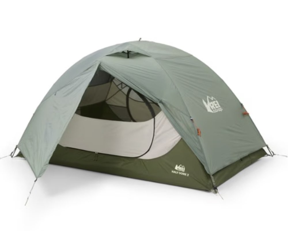 An REI Co-op Half Dome 2 tent set up at a campsite.