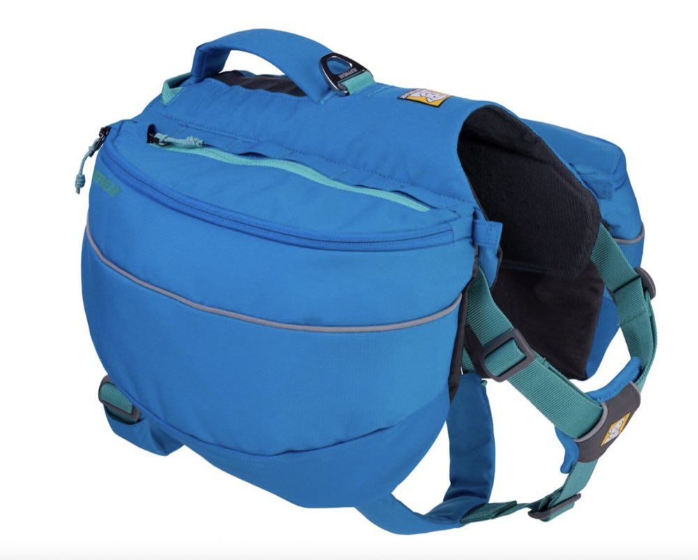 A dog wearing a Ruffwear Approach backpack.