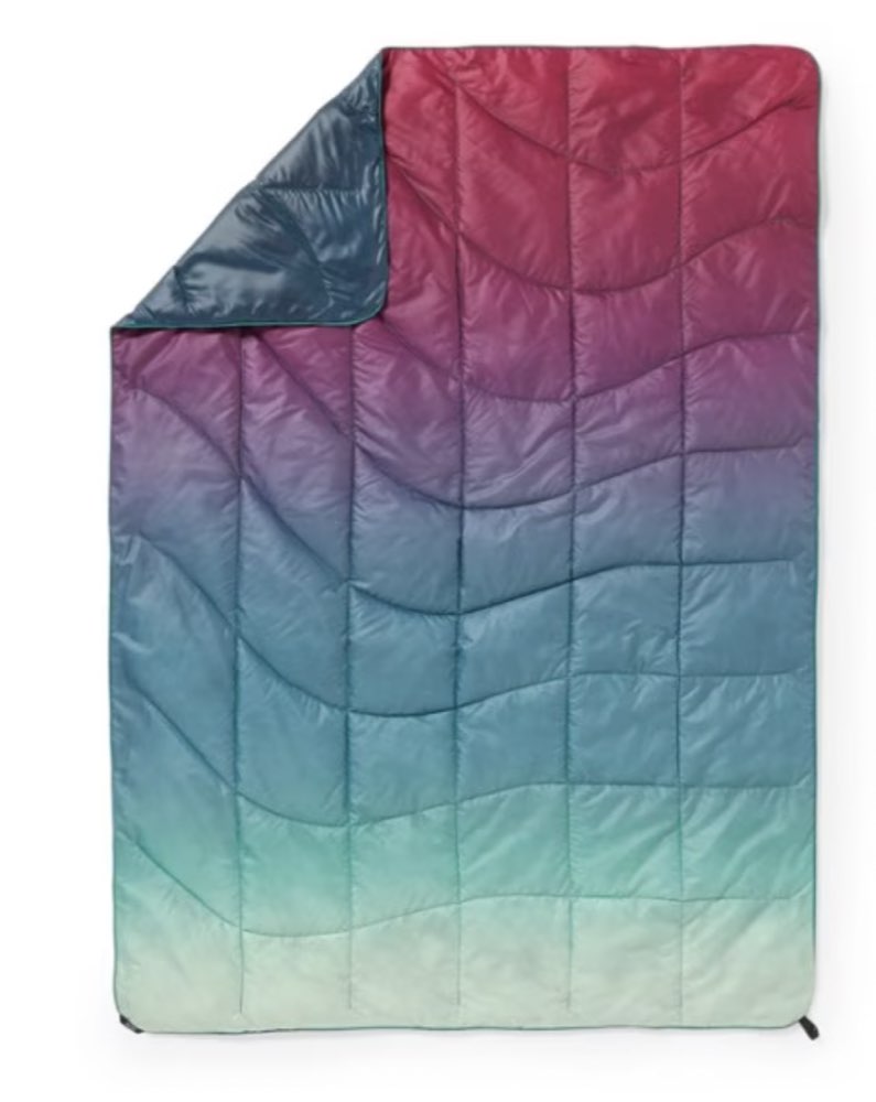 A packable Rumpl puffy camp blanket.